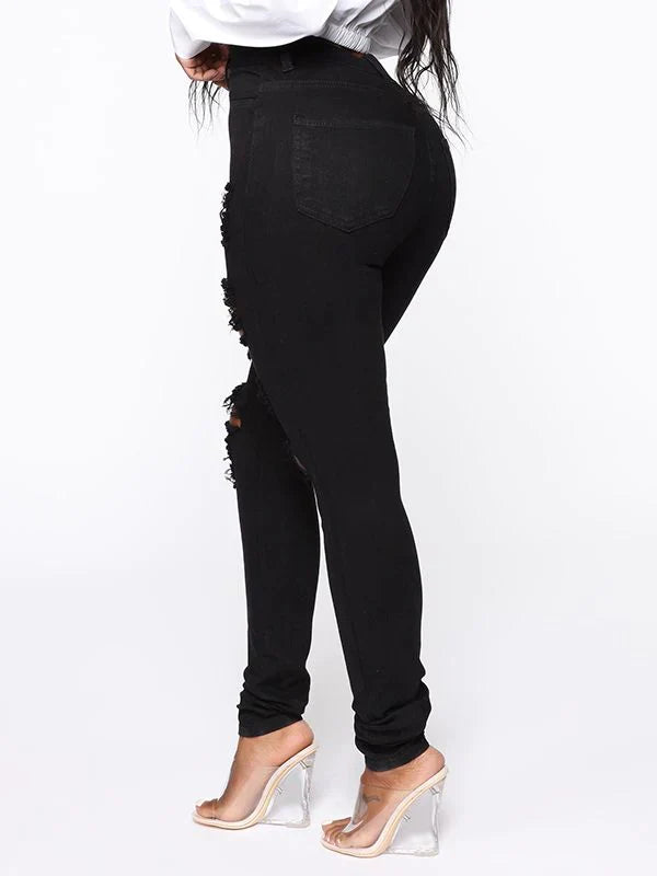 Zerrissene Röhrenjeans